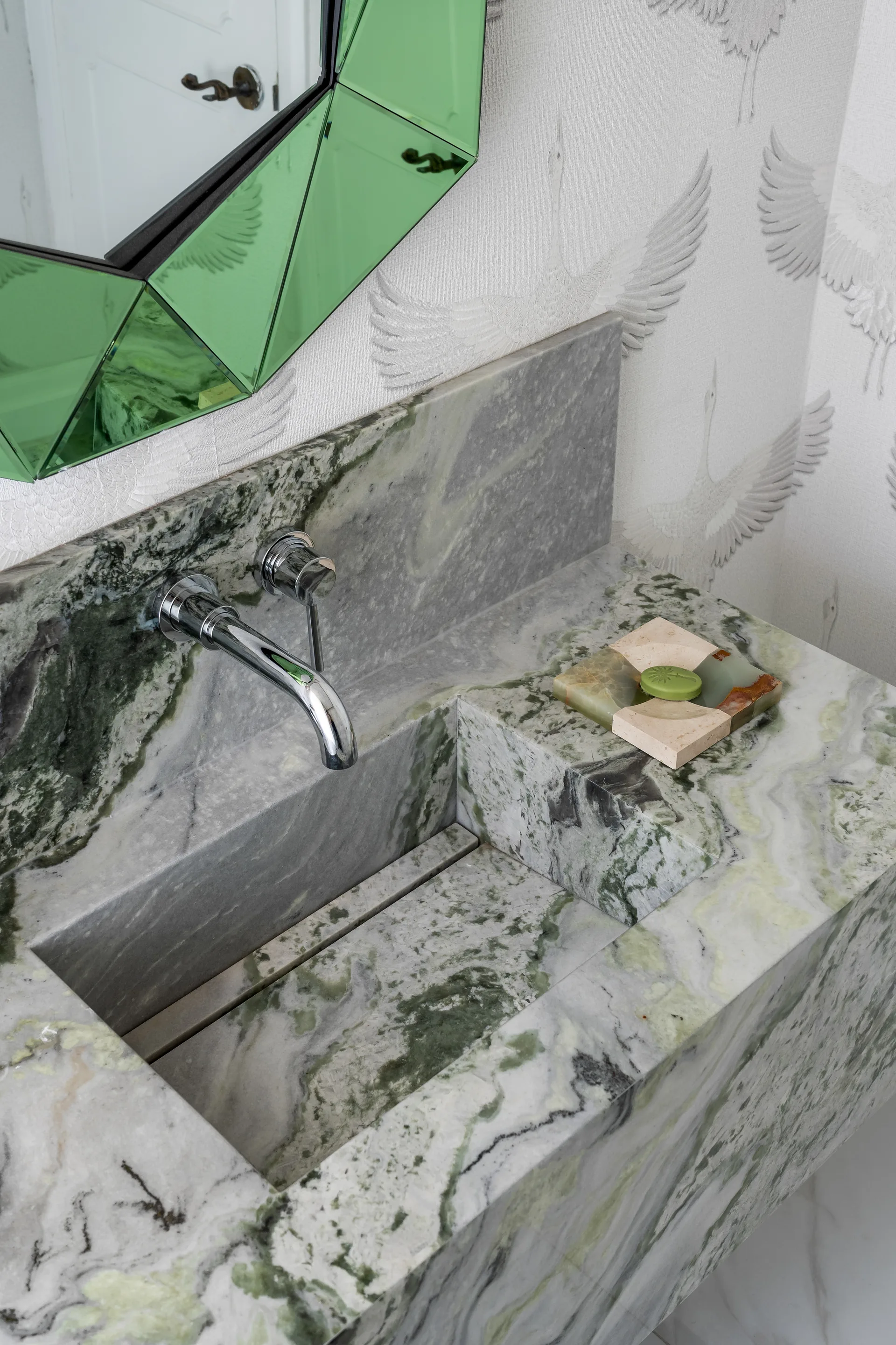 Detail of a green stone bathroom basin