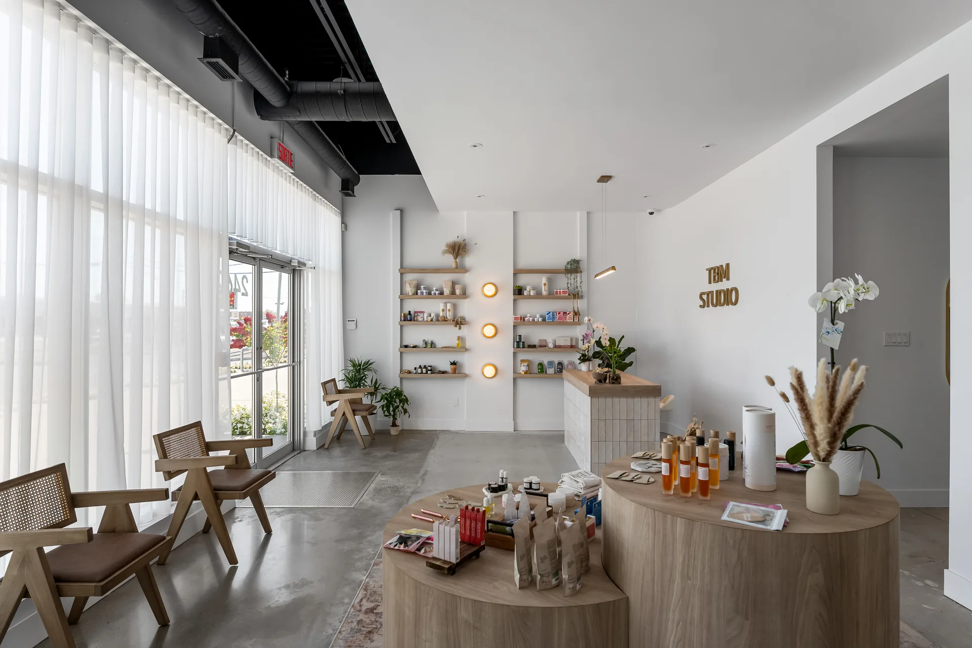 Bright lounge with timber seating and product shelving