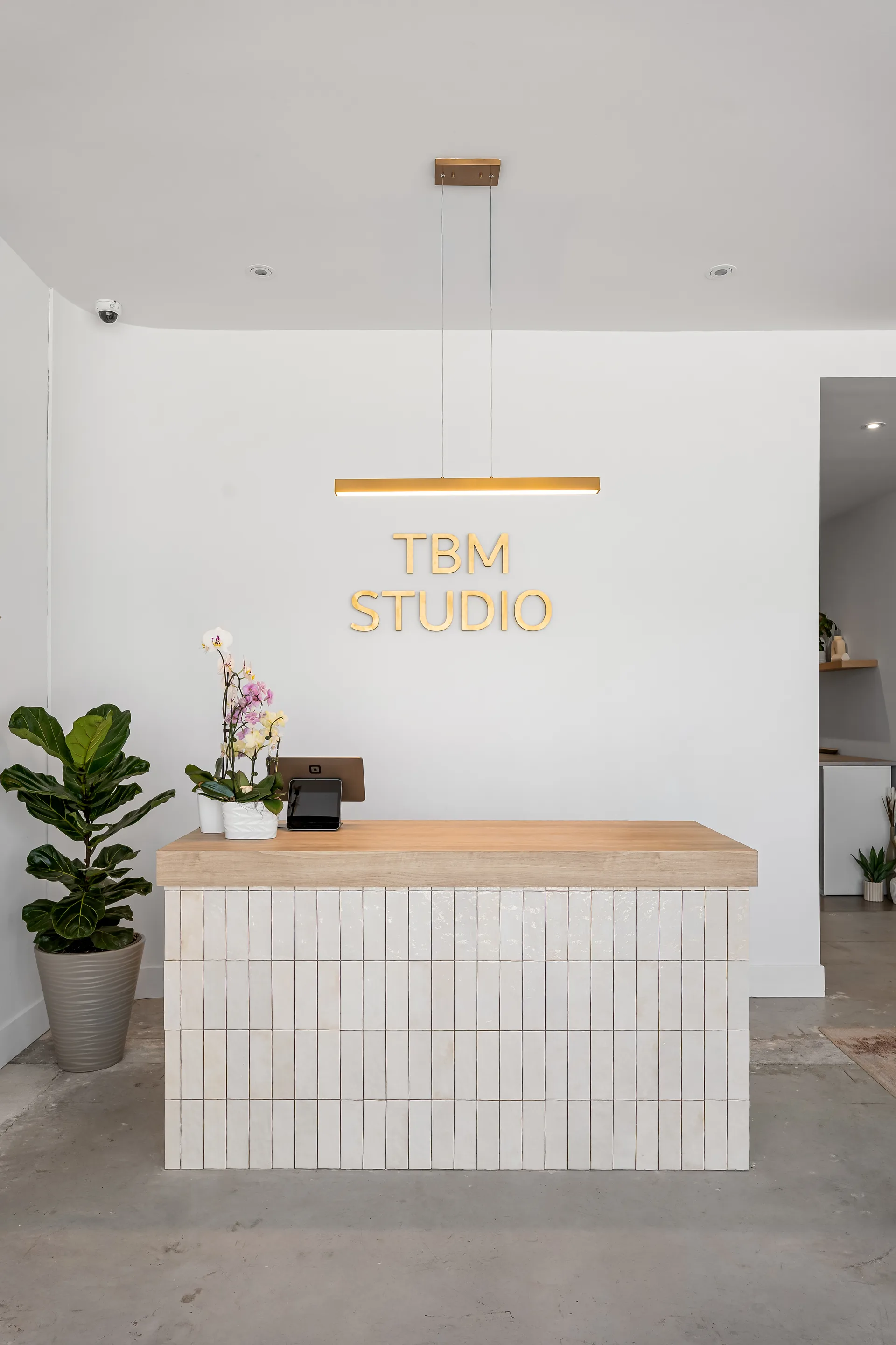 Reception desk beneath the studio sign