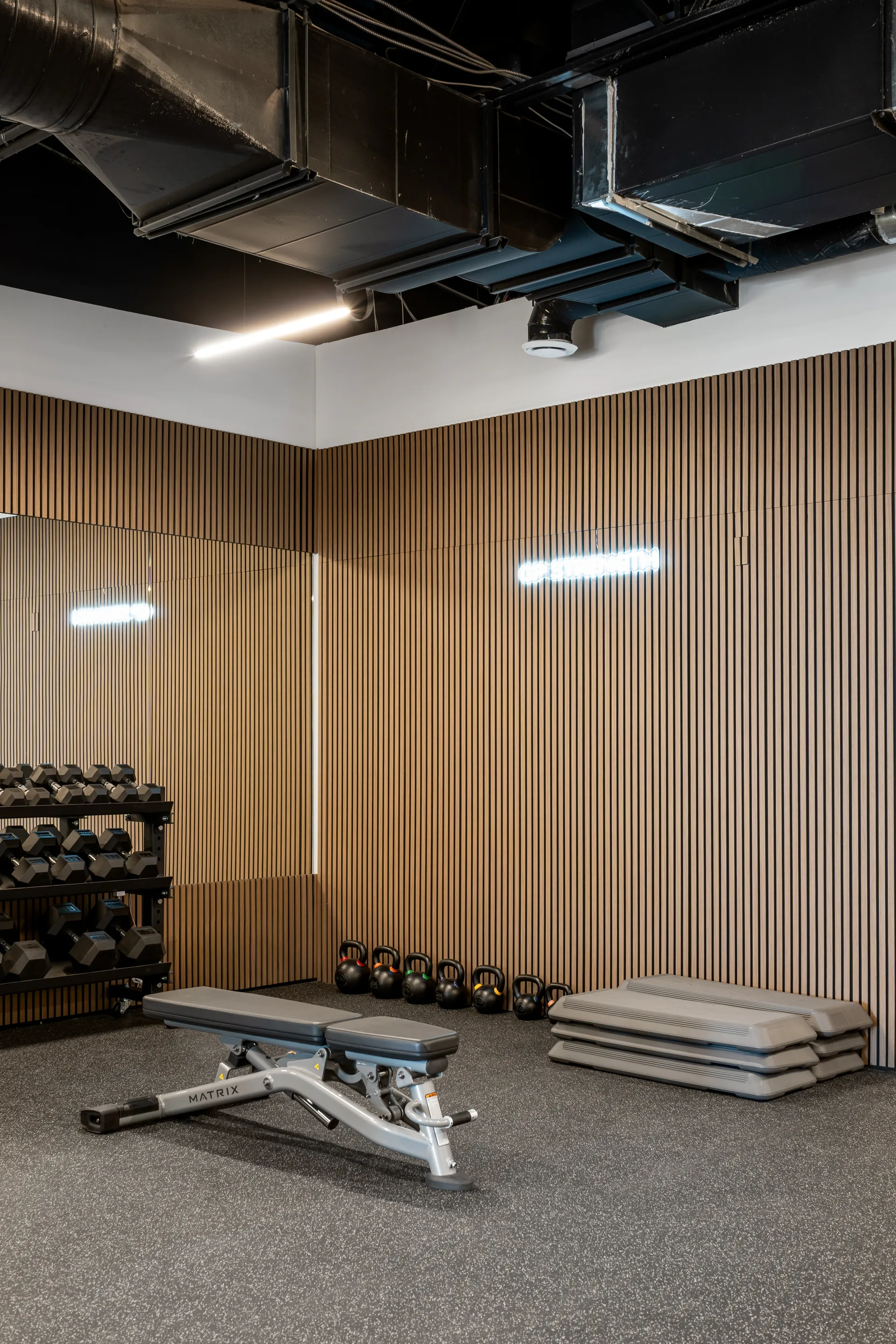Exercise bench beneath an exposed ceiling